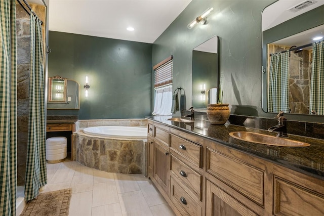 79 Saddle Rock Rdg, Wimberley, TX 78676 - full bath featuring a bath, double vanity, tiled shower, and tile patterned flooring