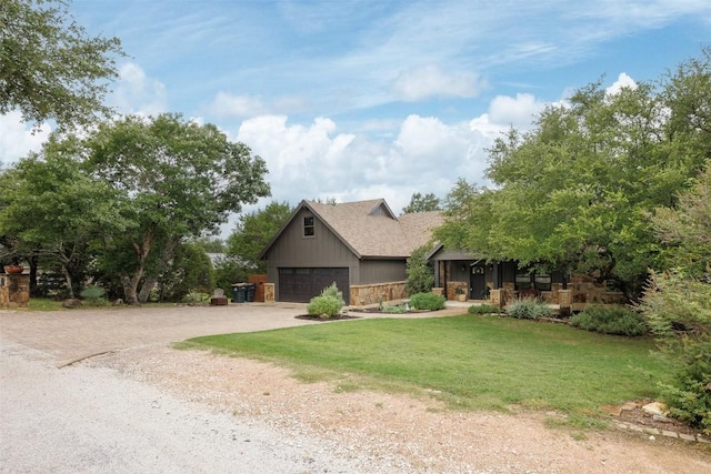 79 Saddle Rock Rdg, Wimberley, TX 78676 - view of front of house with driveway, a front lawn, stone siding, and a shingled roof