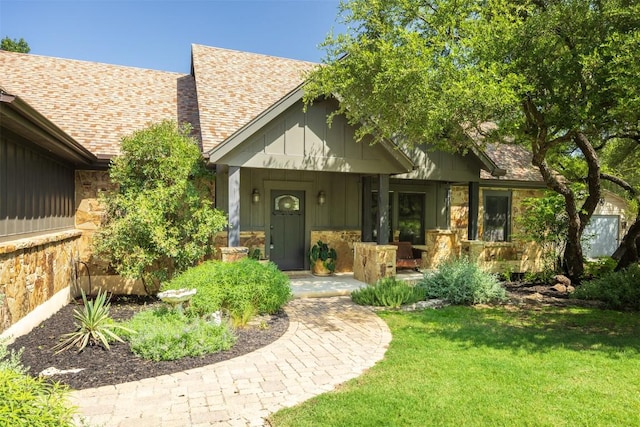 79 Saddle Rock Rdg, Wimberley, TX 78676 - view of front facade featuring a porch, stone siding, and roof with shingles
