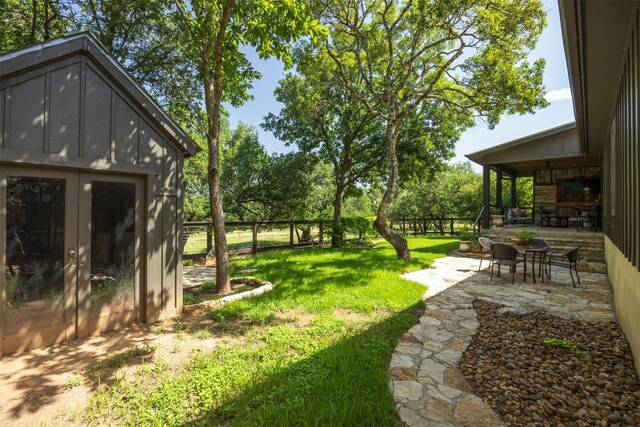 79 Saddle Rock Rdg, Wimberley, TX 78676 - fenced backyard featuring a patio area and french doors