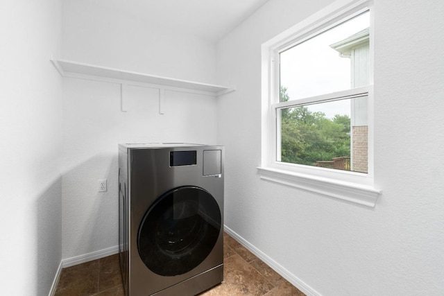 10504 Grand Oak Cir, Austin, TX 78750 - laundry area with washer / dryer and baseboards