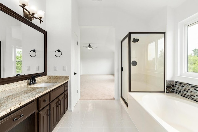 10504 Grand Oak Cir, Austin, TX 78750 - bathroom with a stall shower, vanity, tile patterned floors, and a bath