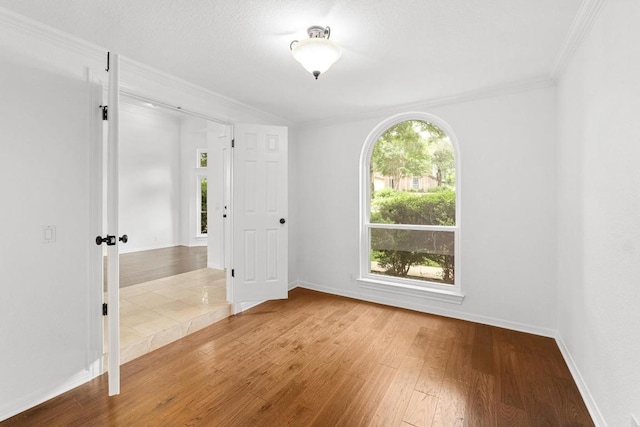 10504 Grand Oak Cir, Austin, TX 78750 - empty room with wood finished floors and ornamental molding