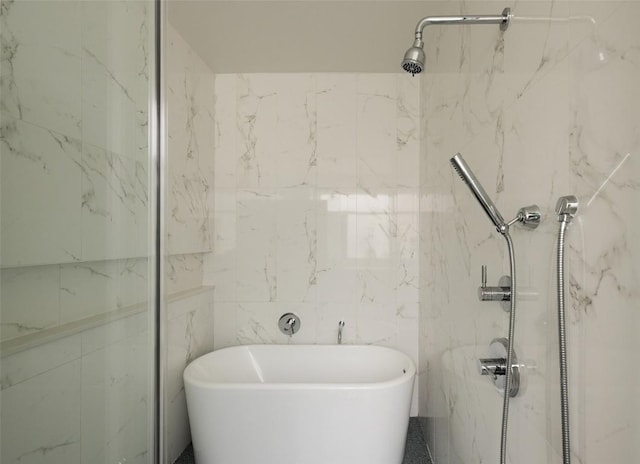 3100 Menchaca Rd Unit 10, Austin, TX 78704 - full bathroom with a soaking tub, a marble finish shower, and tile walls