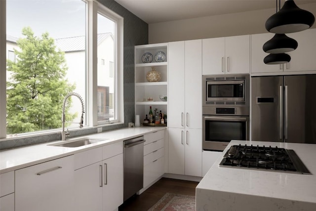 3100 Menchaca Rd Unit 10, Austin, TX 78704 - kitchen featuring stainless steel appliances, open shelves, white cabinetry, and dark wood-style floors