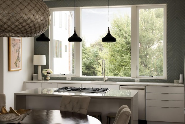 3100 Menchaca Rd Unit 10, Austin, TX 78704 - kitchen featuring appliances with stainless steel finishes, white cabinets, modern cabinets, and light countertops