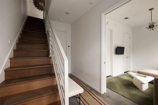 3100 Menchaca Rd Unit 10, Austin, TX 78704 - staircase with baseboards and a chandelier