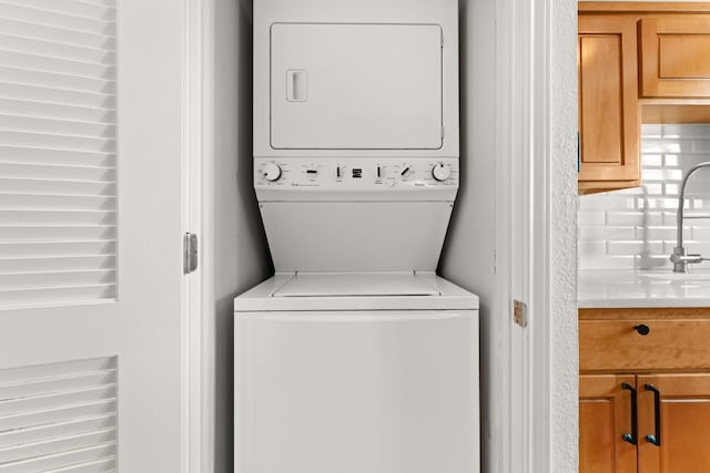 900 S Lamar Blvd Unit 304, Austin, TX 78704 - washroom featuring stacked washer / dryer