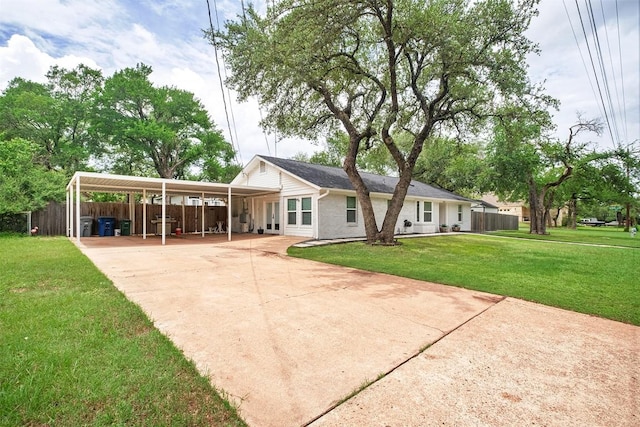 13516 Caldwell Dr, Austin, TX 78750 - back of house with driveway and a carport