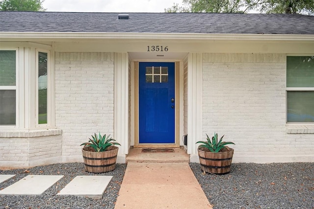 13516 Caldwell Dr, Austin, TX 78750 - entrance to property with brick siding and a shingled roof