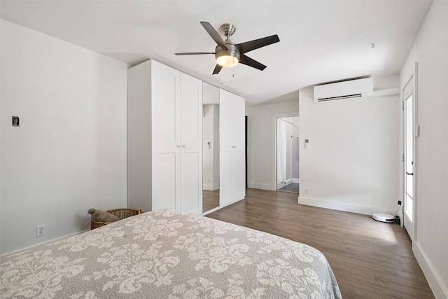 13516 Caldwell Dr, Austin, TX 78750 - bedroom featuring an AC wall unit, wood finished floors, multiple windows, and a closet
