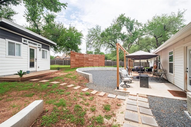 13516 Caldwell Dr, Austin, TX 78750 - fenced backyard with a patio area and an outdoor fire pit
