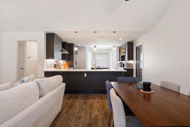 13516 Caldwell Dr, Austin, TX 78750 - dining space with dark wood-style floors and recessed lighting