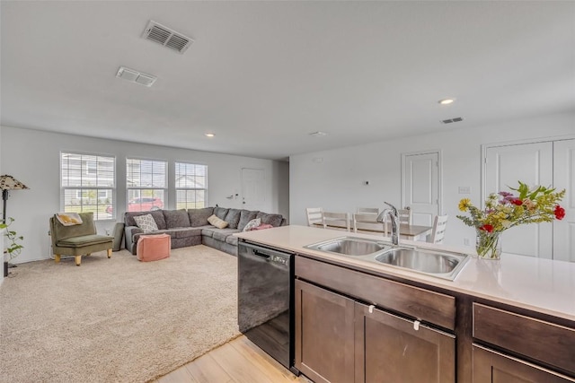 2406 Windrow Ln, Lockhart, TX 78644 - kitchen featuring black dishwasher, light countertops, recessed lighting, and light wood-type flooring