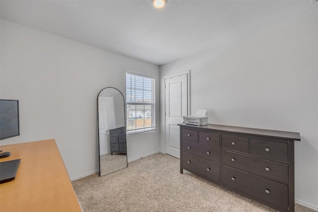 2406 Windrow Ln, Lockhart, TX 78644 - bedroom with light carpet and baseboards
