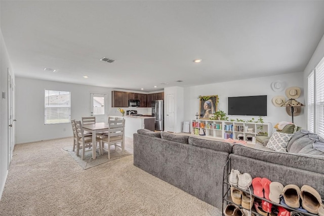 2406 Windrow Ln, Lockhart, TX 78644 - living area with light carpet and recessed lighting