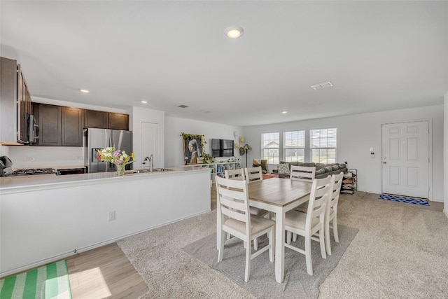 2406 Windrow Ln, Lockhart, TX 78644 - dining room with recessed lighting and light wood-style flooring