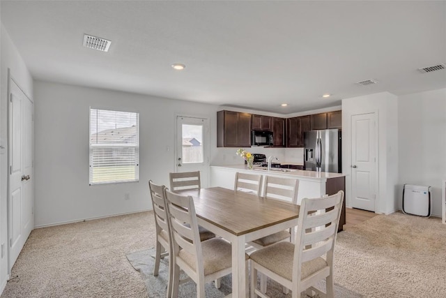 2406 Windrow Ln, Lockhart, TX 78644 - dining area with light carpet and recessed lighting