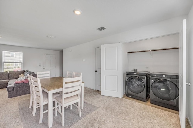 2406 Windrow Ln, Lockhart, TX 78644 - dining room with washer and clothes dryer, light colored carpet, and recessed lighting
