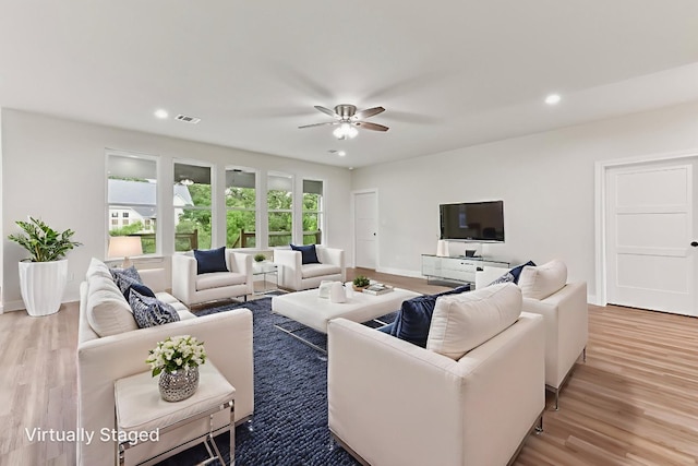 130 Mokalau Dr, Bastrop, TX 78602 - living area with a ceiling fan, wood finished floors, and recessed lighting