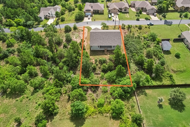 130 Mokalau Dr, Bastrop, TX 78602 - aerial perspective of suburban area with property parcel outlined