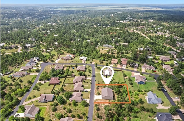 130 Mokalau Dr, Bastrop, TX 78602 - aerial perspective of suburban area with property parcel outlined and a forest