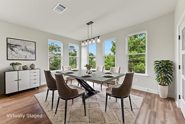 130 Mokalau Dr, Bastrop, TX 78602 - dining room with wood finished floors and baseboards