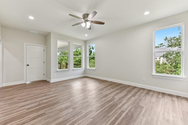 130 Mokalau Dr, Bastrop, TX 78602 - spare room with plenty of natural light, a ceiling fan, light wood-style floors, and recessed lighting
