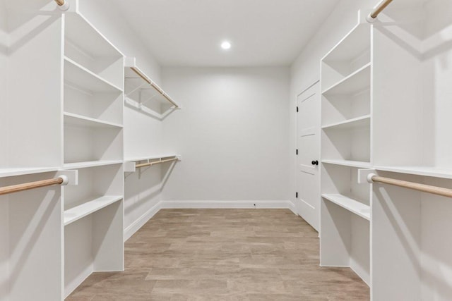 130 Mokalau Dr, Bastrop, TX 78602 - walk in closet with wood finished floors