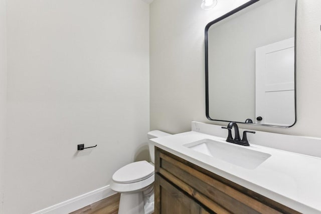 130 Mokalau Dr, Bastrop, TX 78602 - bathroom featuring vanity and wood finished floors