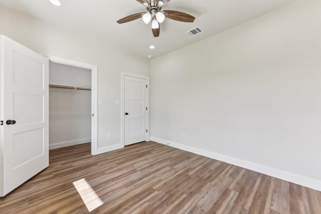 130 Mokalau Dr, Bastrop, TX 78602 - unfurnished bedroom featuring light wood-type flooring, recessed lighting, and a ceiling fan