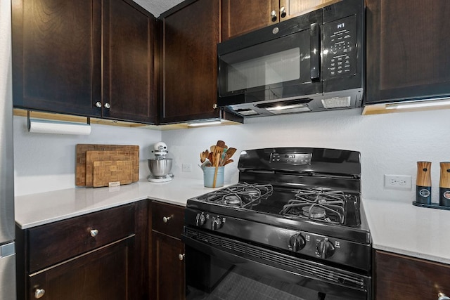 17704 Oso Cv, Elgin, TX 78621 - kitchen with black appliances, dark brown cabinetry, and light countertops
