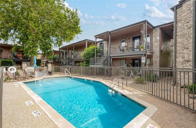 5820 Berkman Dr Unit 205, Austin, TX 78723 - community pool with a patio area and stairway