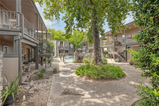 5820 Berkman Dr Unit 205, Austin, TX 78723 - view of home's community with stairs and a swimming pool