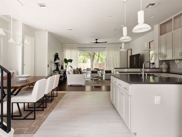 5408 Prock Ln Unit A, Austin, TX 78721 - kitchen with dark countertops, ceiling fan, recessed lighting, decorative light fixtures, and open floor plan