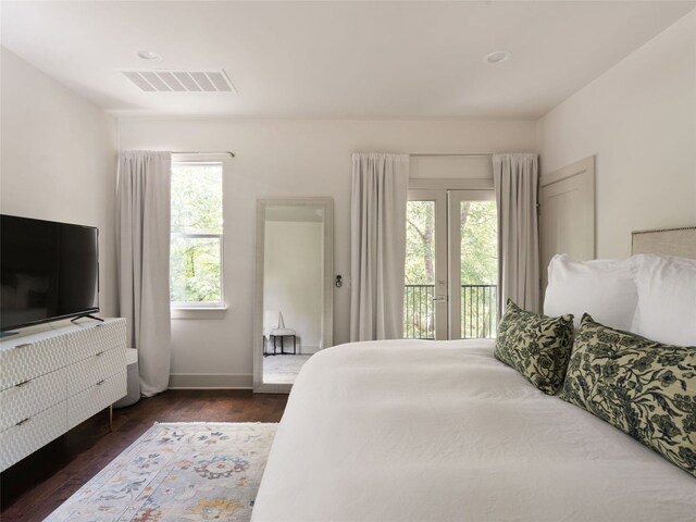 5408 Prock Ln Unit A, Austin, TX 78721 - bedroom with access to outside and dark wood-type flooring