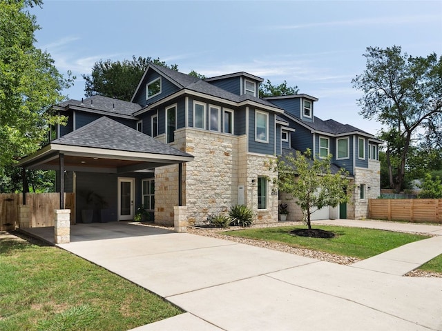 5408 Prock Ln Unit A, Austin, TX 78721 - view of front facade with stone siding, driveway, and roof with shingles