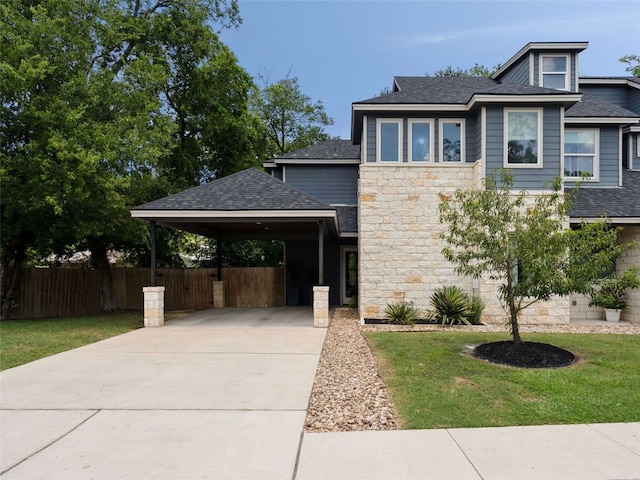 5408 Prock Ln Unit A, Austin, TX 78721 - view of front of house featuring stone siding, driveway, a shingled roof, and a carport