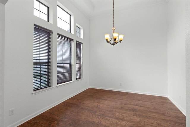 211 Longmont Ln, Austin, TX 78737 - empty room featuring a chandelier, crown molding, and dark wood-style floors