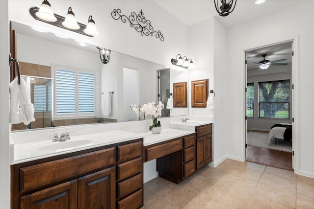 211 Longmont Ln, Austin, TX 78737 - full bath featuring connected bathroom, double vanity, a stall shower, tile patterned floors, and a ceiling fan