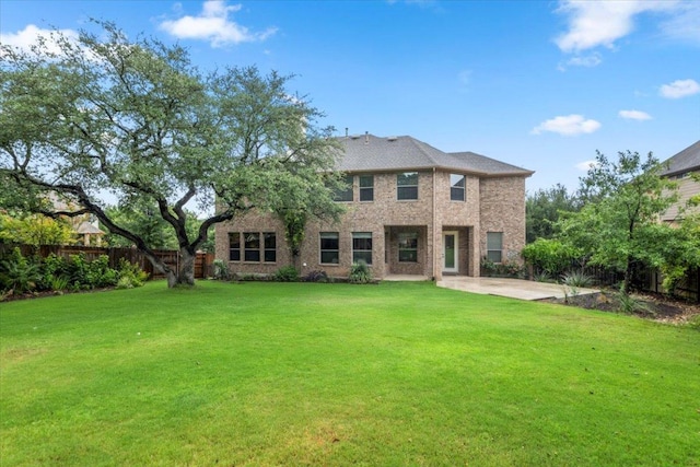 211 Longmont Ln, Austin, TX 78737 - back of house featuring a patio area and brick siding