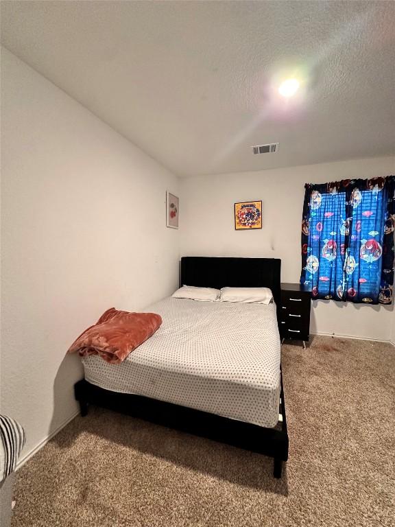 1214 Smallmouth Rd, Bastrop, TX 78602 - bedroom with carpet flooring and baseboards