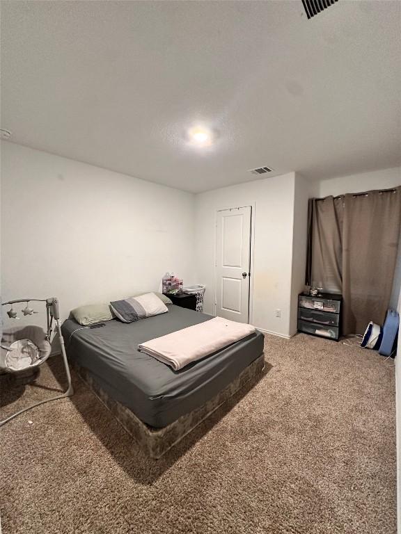 1214 Smallmouth Rd, Bastrop, TX 78602 - carpeted bedroom with baseboards