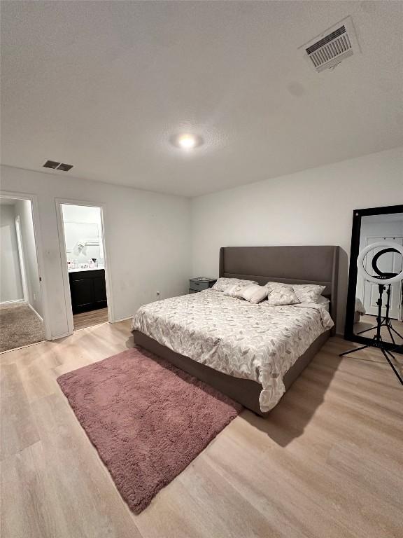 1214 Smallmouth Rd, Bastrop, TX 78602 - bedroom featuring wood finished floors and baseboards