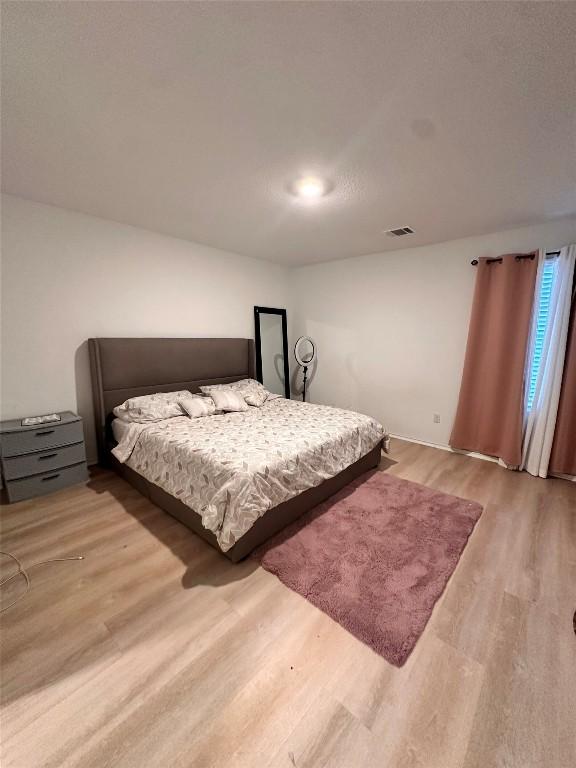1214 Smallmouth Rd, Bastrop, TX 78602 - bedroom featuring wood finished floors