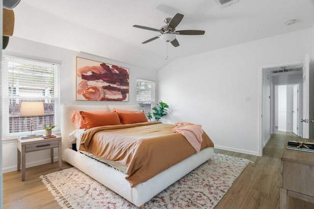 9273 Vigen Cir, Austin, TX 78748 - bedroom featuring wood finished floors, vaulted ceiling, and a ceiling fan