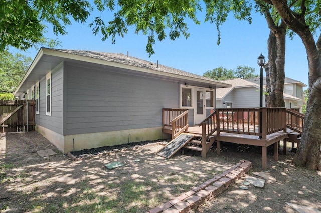 9273 Vigen Cir, Austin, TX 78748 - rear view of house with a wooden deck
