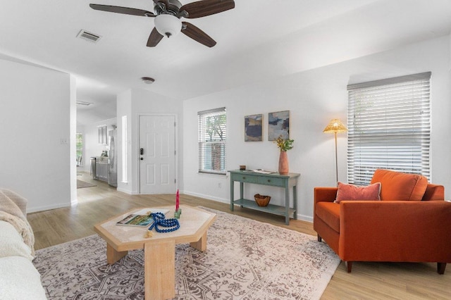 9273 Vigen Cir, Austin, TX 78748 - living room with light wood-style floors, ceiling fan, and lofted ceiling