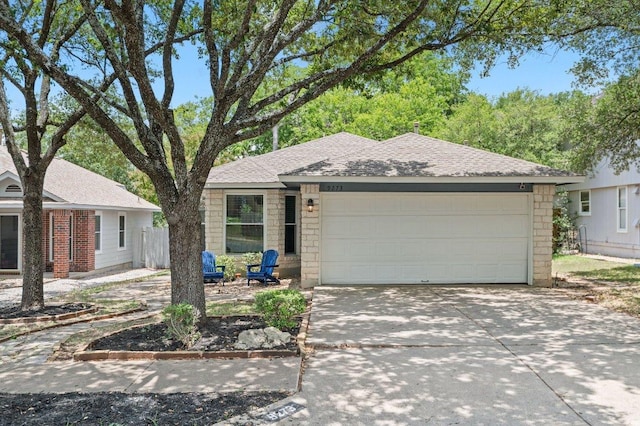 9273 Vigen Cir, Austin, TX 78748 - ranch-style home featuring concrete driveway, a garage, and roof with shingles