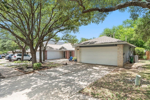 9273 Vigen Cir, Austin, TX 78748 - view of front of home featuring a garage, concrete driveway, and roof with shingles